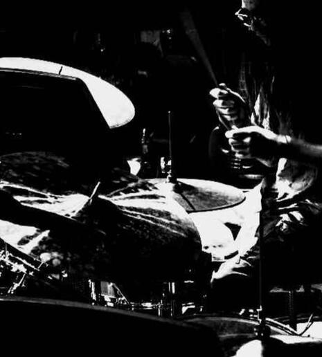 DRaineImage2 Photo from December 2024 of Raine playing drums on a live cover of "Cooler Than Me" by Ethan Fields (Originally by Mike Posner)